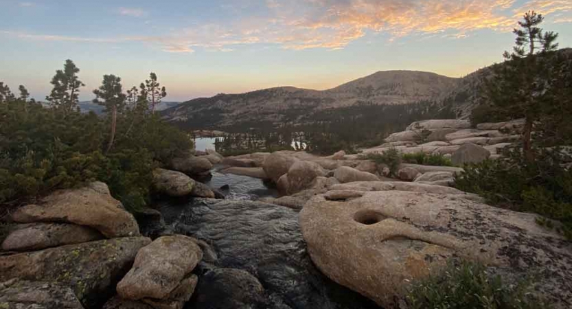 a creek flows through rocks in the sierra nevada range